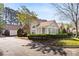 Charming home exterior with manicured landscaping, a combination of brick and siding at 3858 Vineyards Lake Nw Cir # U-19, Kennesaw, GA 30144