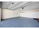 Spacious garage with painted floor, white storage cabinets and ample room for parking at 3858 Vineyards Lake Nw Cir # U-19, Kennesaw, GA 30144