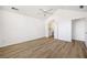 A bright main bedroom features a ceiling fan, wood-look floors, and entrance to the bathroom at 3858 Vineyards Lake Nw Cir # U-19, Kennesaw, GA 30144