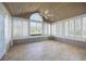 Bright sunroom with tile flooring, many windows, and vaulted ceiling, providing ample natural light at 3858 Vineyards Lake Nw Cir # U-19, Kennesaw, GA 30144
