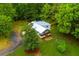 Charming home boasts a white exterior, a welcoming porch, and surrounded by trees at 505 Cedar Creek Nw Rd, Cartersville, GA 30121