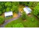 Property features a detached garage, driveway, and beautiful lawn with wooded views at 505 Cedar Creek Nw Rd, Cartersville, GA 30121