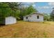 Back of house and shed on a property surrounded by trees at 505 Cedar Creek Nw Rd, Cartersville, GA 30121