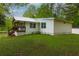 Side exterior view of the house showing the yard and white siding at 505 Cedar Creek Nw Rd, Cartersville, GA 30121