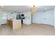 Open kitchen features white cabinets, stainless steel appliances, and a center island with quartz countertops at 505 Cedar Creek Nw Rd, Cartersville, GA 30121