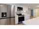 Kitchen with stainless steel appliances, white cabinets, and quartz countertops at 505 Cedar Creek Nw Rd, Cartersville, GA 30121