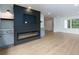 Living room featuring a modern electric fireplace with built-ins and stylish flooring at 505 Cedar Creek Nw Rd, Cartersville, GA 30121