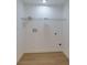 Room featuring wood-look flooring, white walls, base trim, and an installed wire shelf at 505 Cedar Creek Nw Rd, Cartersville, GA 30121