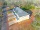 Aerial view of home showing driveway, surrounding landscape and proximity to the street at 6860 Robinson St, Lithonia, GA 30058