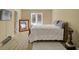 Serene bedroom with natural light and neutral tones, featuring wood floors and cozy decor at 6860 Robinson St, Lithonia, GA 30058