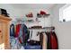 Organized walk-in closet featuring clothing racks, shelves, and a window providing natural light at 6860 Robinson St, Lithonia, GA 30058