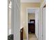 Hallway view featuring a bedroom and bath, with warm neutral paint at 6860 Robinson St, Lithonia, GA 30058