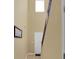 New townhome hallway with vinyl plank flooring, an elegant light fixture, and front door access at 6860 Robinson St, Lithonia, GA 30058