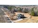 Aerial view of the property, highlighting the mature trees, surrounding greenery, and the home's location at 135 Antoinette Ave, Mcdonough, GA 30252