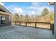 Expansive wooden deck overlooking the backyard, perfect for relaxation and entertaining guests at 135 Antoinette Ave, Mcdonough, GA 30252