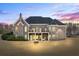 This home includes a covered patio, balcony, large backyard, and outdoor fireplace, perfect for entertaining at 135 Antoinette Ave, Mcdonough, GA 30252