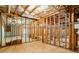 Spacious unfinished basement, presenting opportunities for customization, with exposed beams and ductwork at 135 Antoinette Ave, Mcdonough, GA 30252