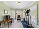 A bright room with a treadmill and two chairs at 135 Antoinette Ave, Mcdonough, GA 30252