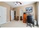 Bedroom with a desk and chair and three door ways leading to other rooms at 135 Antoinette Ave, Mcdonough, GA 30252