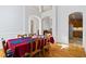 Dining area featuring hardwood floors, high ceilings, arched doorways, and views of the kitchen at 135 Antoinette Ave, Mcdonough, GA 30252