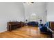 Vaulted living room featuring hardwood floors, plenty of natural light, and neutral color scheme at 135 Antoinette Ave, Mcdonough, GA 30252