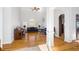 Spacious living room with hardwood floors, tall ceilings, large windows, and neutral color palette at 135 Antoinette Ave, Mcdonough, GA 30252