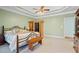 Large bedroom with natural light, a seating area, a sauna, ceiling fan and a bed at 135 Antoinette Ave, Mcdonough, GA 30252