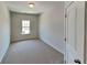 Cozy bedroom with neutral carpet and natural light from the window at 156 Crescent Wooode Dr, Dallas, GA 30157