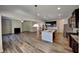 Open kitchen layout with stainless appliances, granite counters, and seamless transition to the living area at 156 Crescent Wooode Dr, Dallas, GA 30157