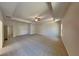 Expansive main bedroom with tray ceiling, neutral carpet, and ample space for relaxation at 156 Crescent Wooode Dr, Dallas, GA 30157