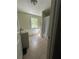 Bathroom featuring a vanity with light green cabinets, a toilet, and a walk-in shower with white curtain at 2245 Panstone Sw Dr, Marietta, GA 30060