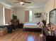 Bedroom features laminate flooring, a desk, and a window that fills the space with natural light at 2245 Panstone Sw Dr, Marietta, GA 30060
