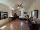 Open bedroom offers laminate floors, a ceiling fan, and natural light from the two windows at 2245 Panstone Sw Dr, Marietta, GA 30060