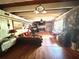 Comfortable living room with hardwood floors, brick fireplace, and large windows offering ample natural light at 2245 Panstone Sw Dr, Marietta, GA 30060