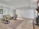 Finished basement with tile floors, comfortable seating, and a cozy fireplace for relaxation at 115 Beechwood Trl, Roswell, GA 30075