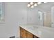 Bright bathroom features a spacious vanity with an ample counter and modern fixtures at 115 Beechwood Trl, Roswell, GA 30075
