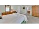 Comfortable bedroom boasts carpet floors, a vanity, and an armoire, creating a peaceful retreat at 115 Beechwood Trl, Roswell, GA 30075