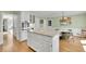 Open concept kitchen features a large island, granite countertops, stainless steel appliances, and an eat-in dining area at 115 Beechwood Trl, Roswell, GA 30075