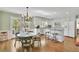 Spacious eat-in kitchen features an island, seating, stainless steel appliances, and backyard views at 115 Beechwood Trl, Roswell, GA 30075
