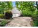 Exterior featuring a two-car garage, driveway, and lush landscaping at 1270 Cameron Crk, Marietta, GA 30062