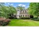 Charming two-story brick home with manicured lawn, mature trees, and a beautiful bay window feature at 1270 Cameron Crk, Marietta, GA 30062