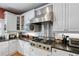 Well-equipped kitchen with stainless steel appliances, granite countertops, gas range, and white cabinetry at 1270 Cameron Crk, Marietta, GA 30062