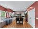 Modern kitchen with stainless steel appliances, granite countertops, white cabinets, and hardwood floors at 1270 Cameron Crk, Marietta, GA 30062