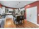 Eat-in kitchen with stainless steel appliances, granite countertops, white cabinets, and hardwood floors at 1270 Cameron Crk, Marietta, GA 30062