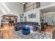 Open-concept living room featuring hardwood floors, soaring ceilings, fireplace, and seamless transition to the kitchen at 1270 Cameron Crk, Marietta, GA 30062