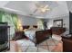 Comfortable main bedroom featuring trey ceilings, a ceiling fan, and hardwood floors at 1270 Cameron Crk, Marietta, GA 30062