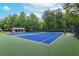Community tennis courts with blue playing surface and well-maintained green surroundings at 1270 Cameron Crk, Marietta, GA 30062