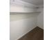 Walk-in closet with white walls and wire shelving for convenient storage at 2424 Turtle Xing Ne, Marietta, GA 30066