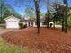 Charming one-story home with a well-manicured front yard and an attached garage at 2424 Turtle Xing Ne, Marietta, GA 30066