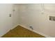 Functional laundry room with standard hookups and white wire shelving for efficient organization at 2424 Turtle Xing Ne, Marietta, GA 30066